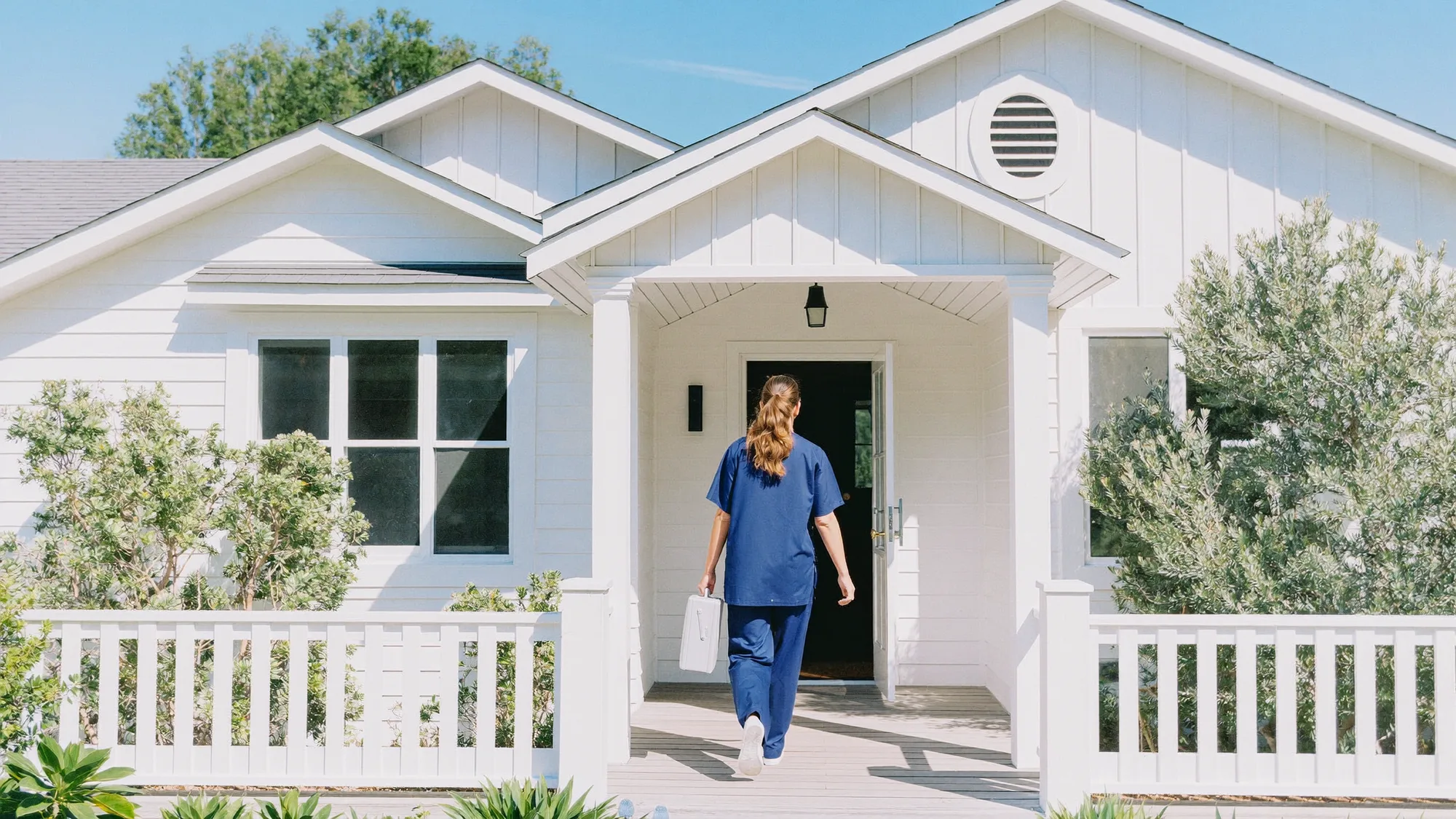 The nurse arriving at a home with her professional case