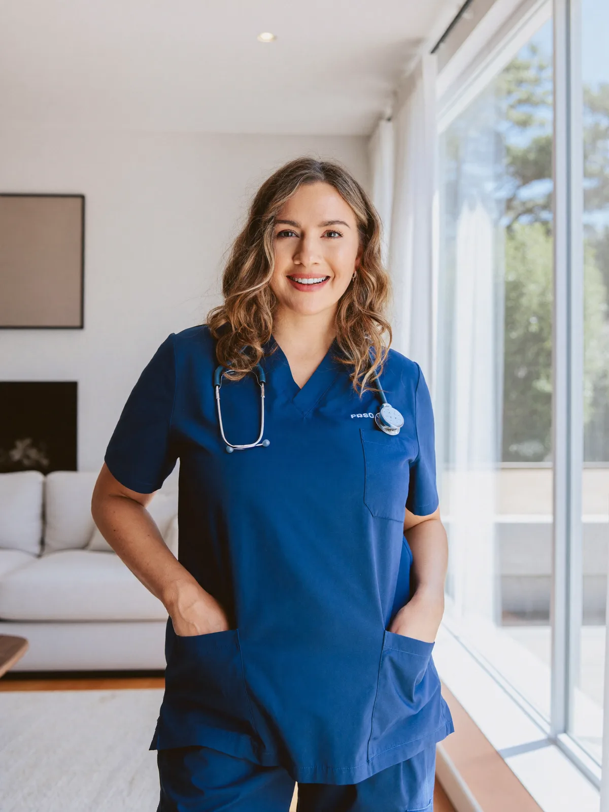 Tatyana, licensed practical nurse, in a bright living room